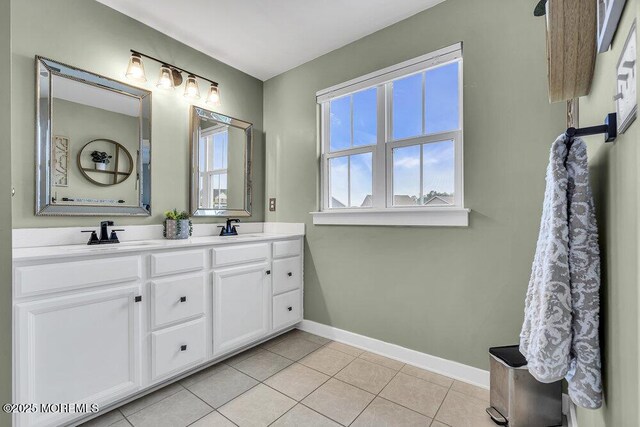 83 Weston Dr, Woolwich, NJ 08085 - bathroom with baseboards, tile patterned flooring, and double vanity