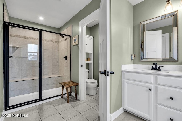 83 Weston Dr, Woolwich, NJ 08085 - bathroom with a stall shower, toilet, tile patterned flooring, vanity, and baseboards