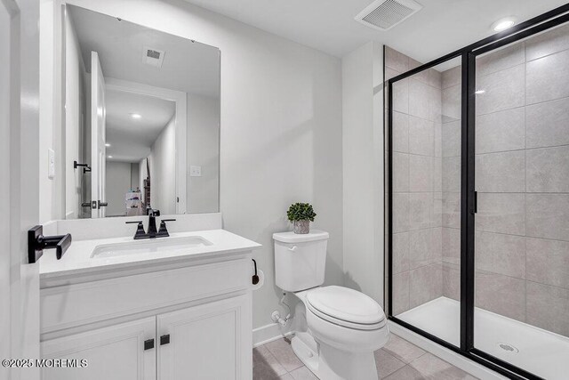 83 Weston Dr, Woolwich, NJ 08085 - full bath featuring a shower stall, toilet, tile patterned flooring, vanity, and recessed lighting