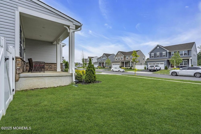 83 Weston Dr, Woolwich, NJ 08085 - view of grassy yard featuring a residential view and covered porch