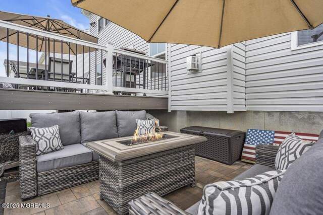 83 Weston Dr, Woolwich, NJ 08085 - view of patio with an outdoor living space with a fire pit, a balcony, and a wall mounted air conditioner