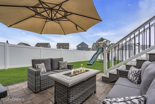 83 Weston Dr, Woolwich, NJ 08085 - view of patio with an outdoor living space with a fire pit and a playground
