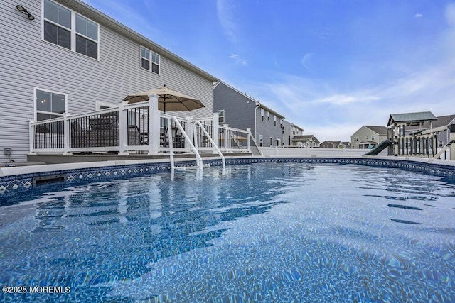 83 Weston Dr, Woolwich, NJ 08085 - outdoor pool featuring a wooden deck and fence