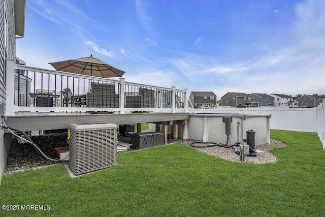 83 Weston Dr, Woolwich, NJ 08085 - rear view of property featuring central AC, a wooden deck, and an outdoor pool