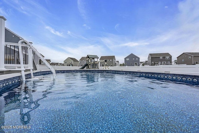 83 Weston Dr, Woolwich, NJ 08085 - swimming pool featuring a fenced backyard and a residential view