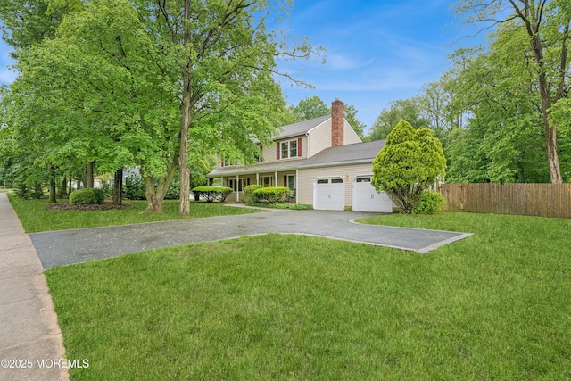 325 Oak Hill Rd, Red Bank, NJ 07701 - traditional-style home featuring asphalt driveway, a garage, and a chimney