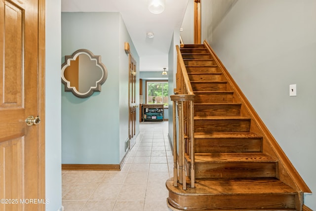 325 Oak Hill Rd, Red Bank, NJ 07701 - staircase featuring tile patterned floors and baseboards