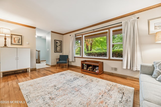 325 Oak Hill Rd, Red Bank, NJ 07701 - living area featuring wood finished floors, crown molding, and baseboards