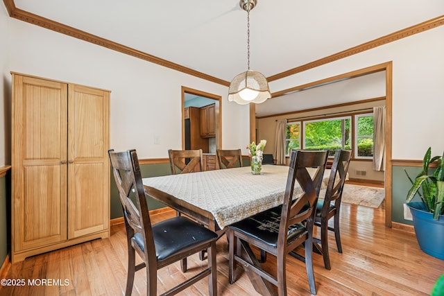 325 Oak Hill Rd, Red Bank, NJ 07701 - dining room featuring light wood-type flooring, ornamental molding, and baseboards