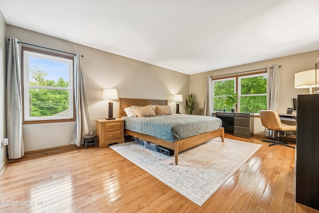 325 Oak Hill Rd, Red Bank, NJ 07701 - bedroom with light wood finished floors, an office area, and baseboards