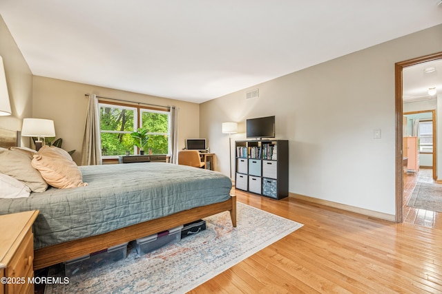 325 Oak Hill Rd, Red Bank, NJ 07701 - bedroom with wood finished floors, multiple windows, and baseboards