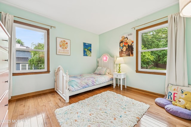 325 Oak Hill Rd, Red Bank, NJ 07701 - bedroom with light wood-style floors, multiple windows, and baseboards