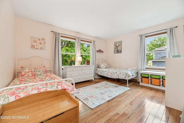 325 Oak Hill Rd, Red Bank, NJ 07701 - bedroom with multiple windows and hardwood / wood-style flooring