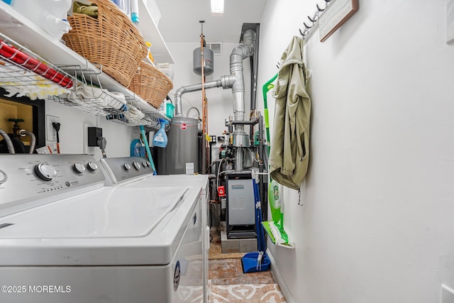 washroom with independent washer and dryer and water heater
