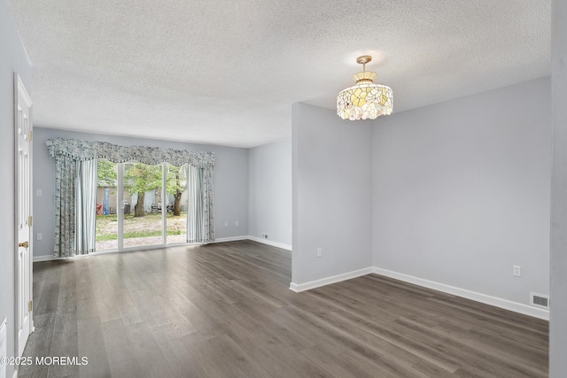 21 Steeple Chase Ct, Tinton Falls, NJ 07724 - unfurnished room with dark wood finished floors, a textured ceiling, and baseboards