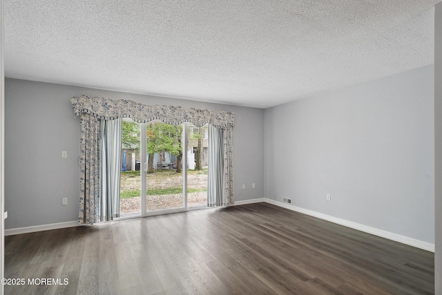 21 Steeple Chase Ct, Tinton Falls, NJ 07724 - empty room with wood finished floors, a textured ceiling, and baseboards