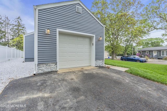 garage featuring driveway