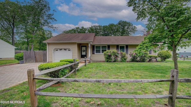 ranch-style house with a garage and driveway