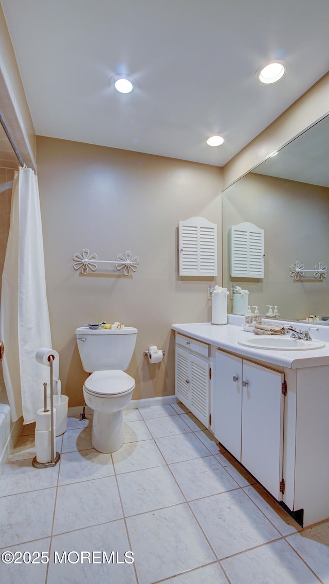 bathroom with toilet, vanity, recessed lighting, tile patterned floors, and baseboards