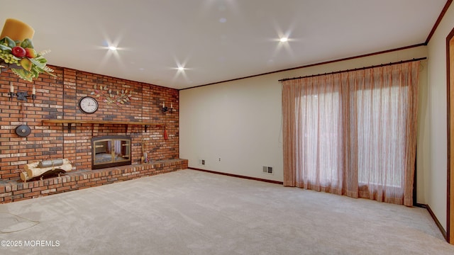 unfurnished living room featuring carpet flooring, baseboards, a fireplace, and crown molding