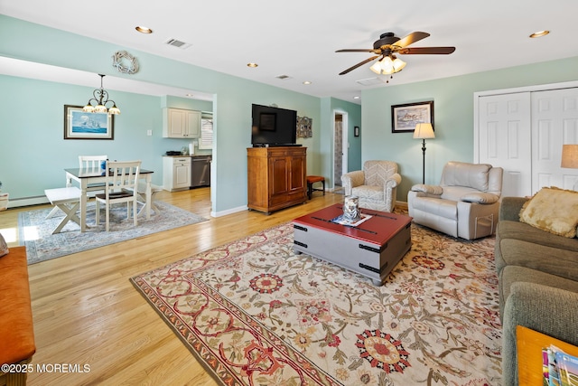 44 Cabana Dr, Brick, NJ 08723 - living area with light wood finished floors, a ceiling fan, a chandelier, baseboard heating, and baseboards