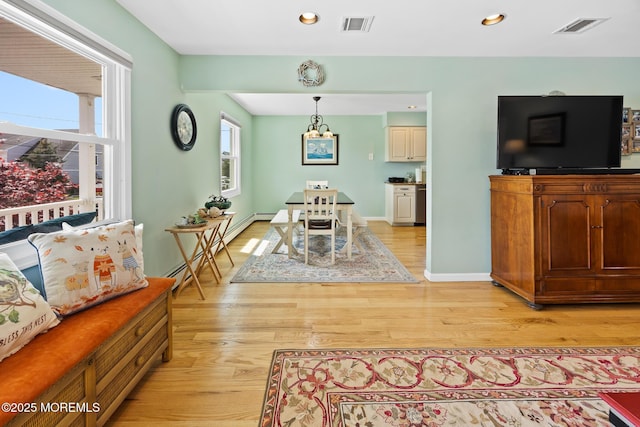 44 Cabana Dr, Brick, NJ 08723 - dining space featuring baseboard heating, light wood finished floors, recessed lighting, a chandelier, and baseboards