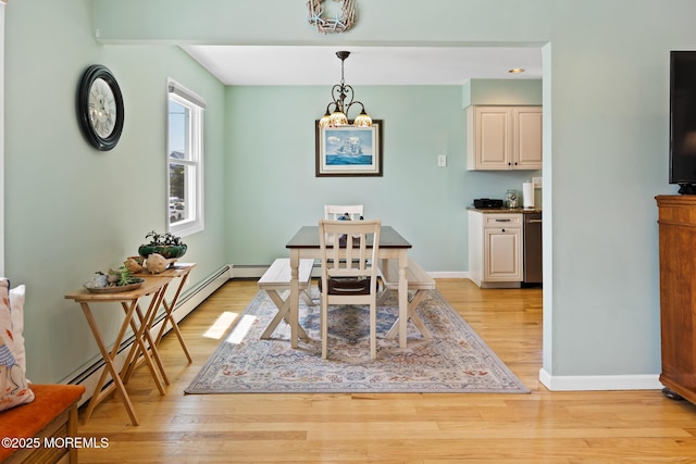 44 Cabana Dr, Brick, NJ 08723 - dining area with baseboards, light wood-type flooring, a chandelier, and a baseboard radiator
