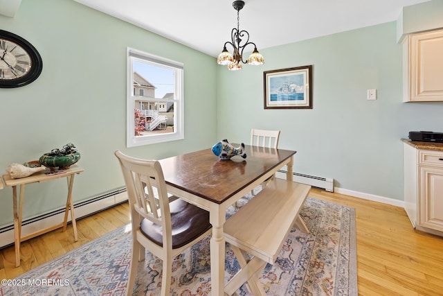 44 Cabana Dr, Brick, NJ 08723 - dining area featuring a baseboard heating unit, light wood-style floors, a chandelier, and baseboards