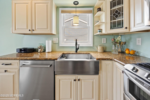 44 Cabana Dr, Brick, NJ 08723 - kitchen featuring appliances with stainless steel finishes, a sink, cream cabinetry, stone counters, and decorative light fixtures