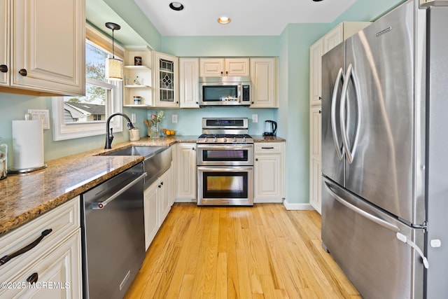 44 Cabana Dr, Brick, NJ 08723 - kitchen with stainless steel appliances, light wood-style floors, dark stone counters, a sink, and recessed lighting