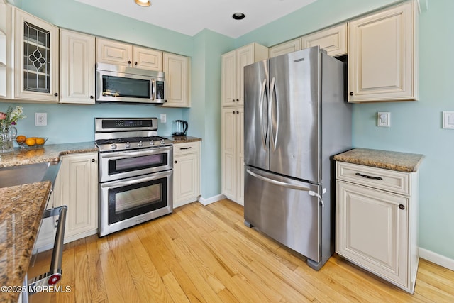 44 Cabana Dr, Brick, NJ 08723 - kitchen with appliances with stainless steel finishes, light wood finished floors, baseboards, glass insert cabinets, and recessed lighting
