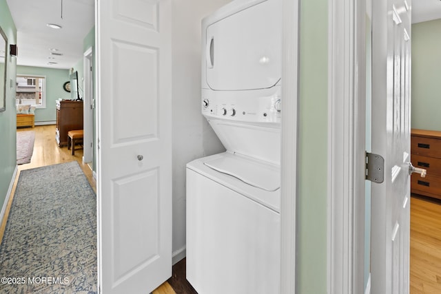 44 Cabana Dr, Brick, NJ 08723 - washroom featuring stacked washer / dryer, wood finished floors, and a baseboard radiator