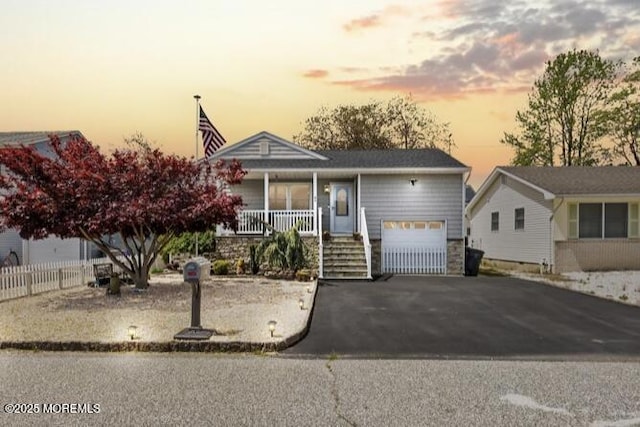 44 Cabana Dr, Brick, NJ 08723 - view of front of house featuring covered porch, a garage, and driveway