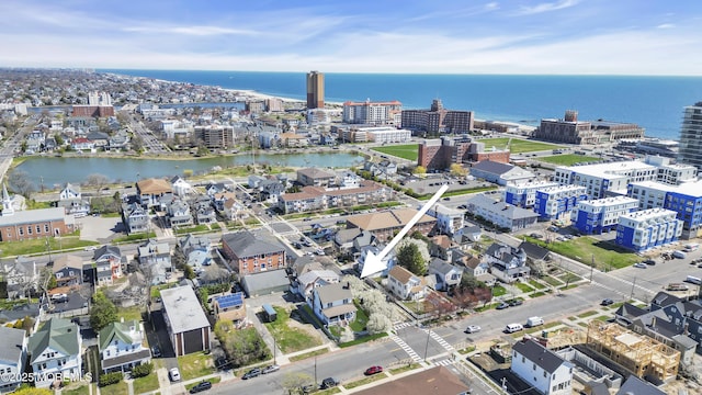 aerial overview of property's location featuring a large body of water and nearby urban area