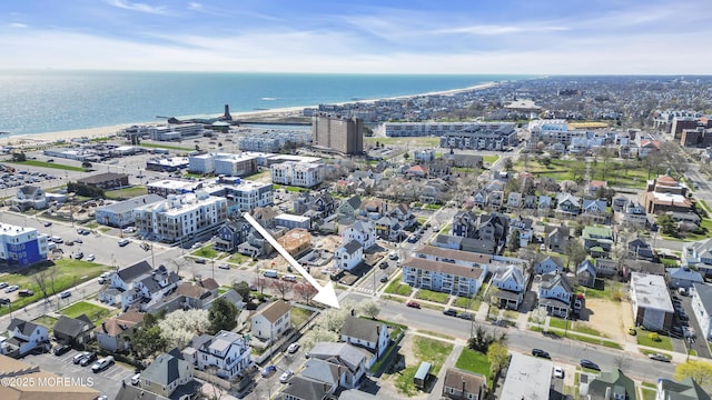 aerial view of property's location featuring a large body of water