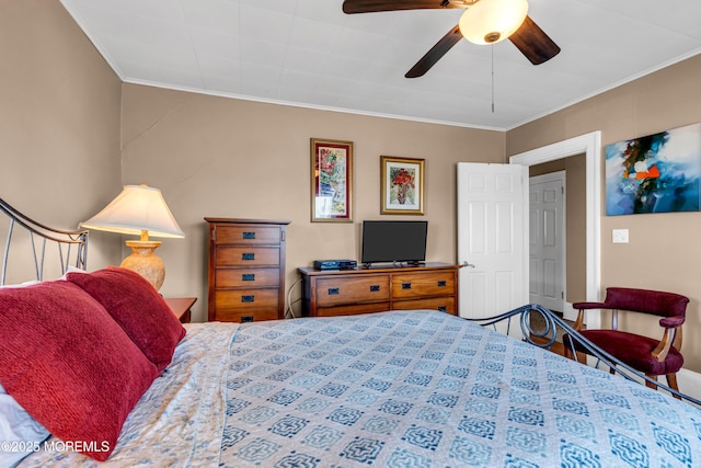 bedroom with crown molding and a ceiling fan