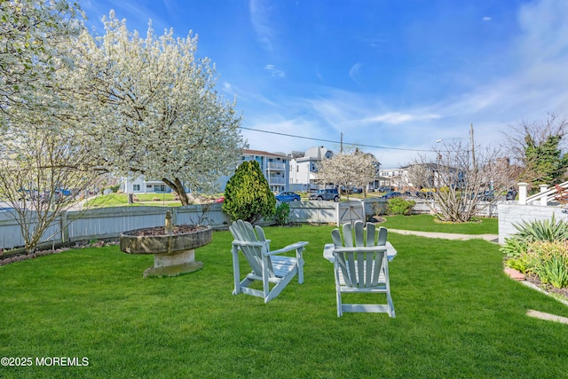 view of yard featuring a fire pit