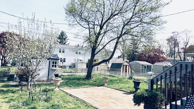 view of yard featuring a shed and an outdoor structure