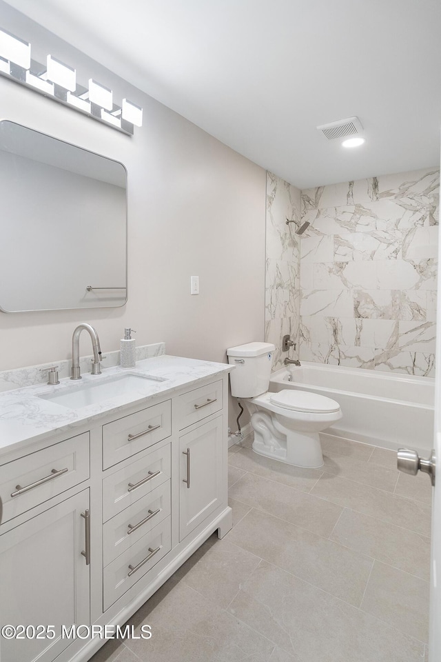 full bath featuring washtub / shower combination, toilet, vanity, and tile patterned floors