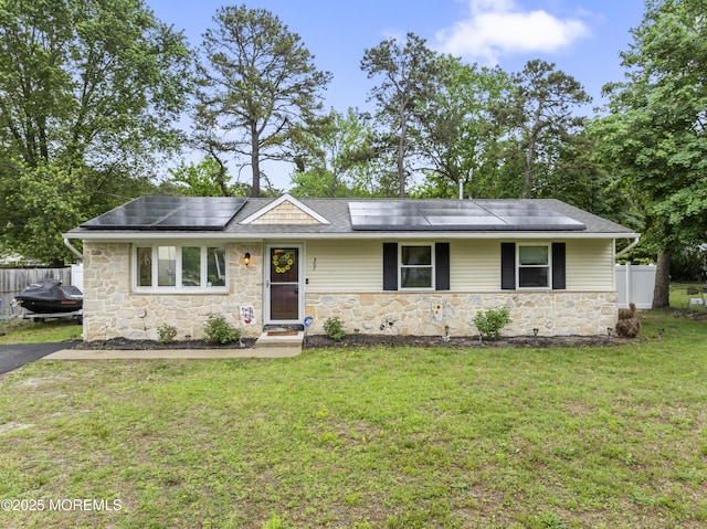 307 Seminole Trl, Browns Mills, NJ 08015 - ranch-style house featuring stone siding, solar panels, and roof with shingles