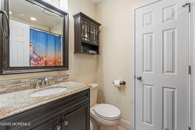 307 Seminole Trl, Browns Mills, NJ 08015 - bathroom featuring tasteful backsplash, toilet, vanity, and baseboards