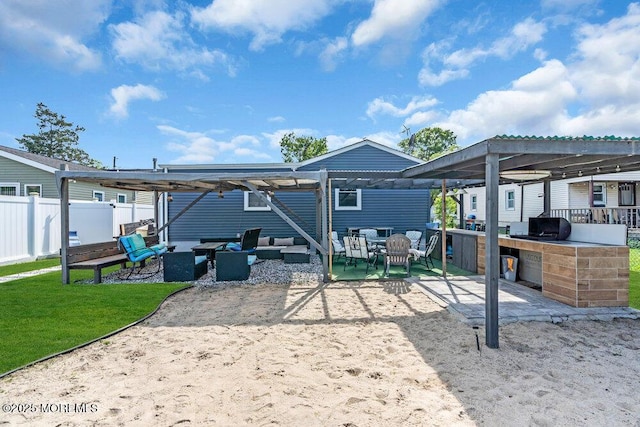 243 6th Ave, Long Branch, NJ 07740 - back of property with an outdoor hangout area, a patio, fence, and exterior kitchen