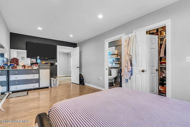 243 6th Ave, Long Branch, NJ 07740 - bedroom with light wood-type flooring, recessed lighting, baseboards, ensuite bath, and a spacious closet