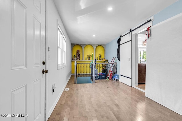 243 6th Ave, Long Branch, NJ 07740 - foyer entrance with wood finished floors, a barn door, recessed lighting, and baseboards