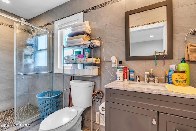 243 6th Ave, Long Branch, NJ 07740 - full bathroom featuring tile walls, a stall shower, vanity, and toilet