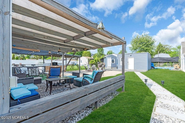 243 6th Ave, Long Branch, NJ 07740 - wooden terrace with a yard, an outbuilding, a storage unit, and a patio area