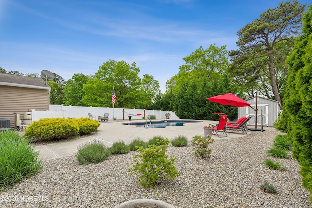 251 Worth St, Brick, NJ 08724 - view of yard featuring a patio, a storage shed, fence, an outdoor structure, and central AC unit