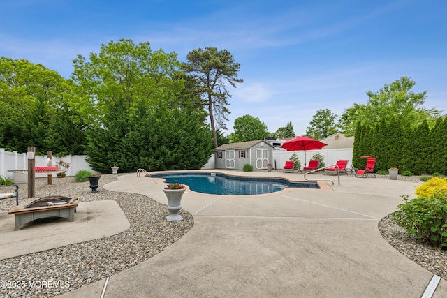 251 Worth St, Brick, NJ 08724 - view of swimming pool with a patio area, a storage shed, a fenced backyard, and an outbuilding