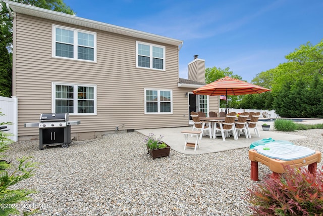 251 Worth St, Brick, NJ 08724 - rear view of house with a patio, a chimney, a swimming pool, and fence