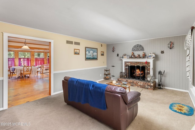 19 Kenyon Dr, Plumsted, NJ 08533 - carpeted living area featuring a fireplace and baseboards